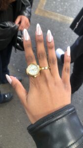 watch ring on fresh manicured nails